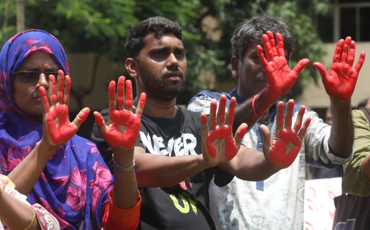 Students imprint red-painted hands on a white canvas in tribute to the martyrs of the 2024 Red July movement, symbolizing unity, resistance, and remembrance. (Photo: AH Mintu, V7N)